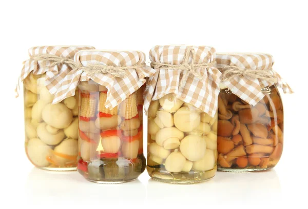 Delicious marinated mushrooms in glass jars, isolated on white — Stock Photo, Image