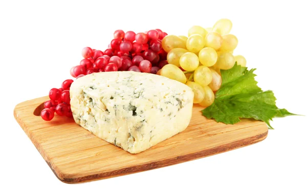 Tasty blue cheese and grape on cutting board, isolated on white — Stock Photo, Image