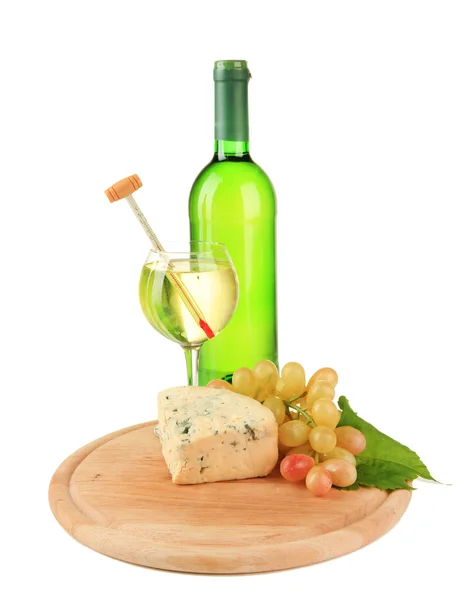 Wine, tasty blue cheese and grape on cutting board, isolated on white — Stock Photo, Image