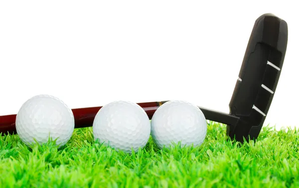 Golf balls and driver on grass isolated on white — Stock Photo, Image