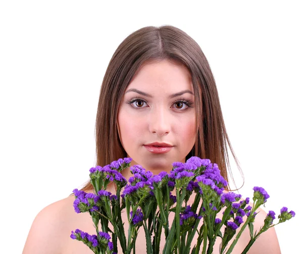 Krásná mladá žena s květinami izolovaných na bílém — Stock fotografie