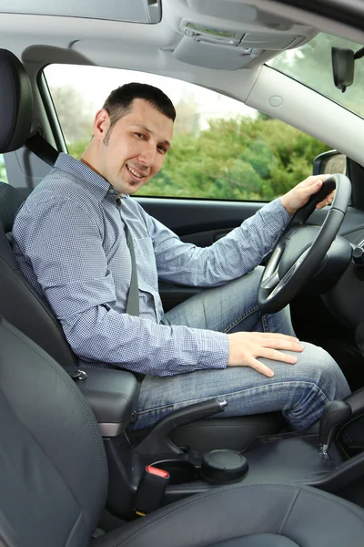 Portrait of young man sitting in the car — Stock Photo, Image