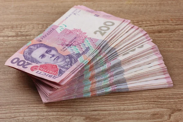 Ukrainian money on wooden background — Stock Photo, Image