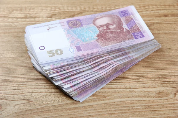 Ukrainian money on wooden background — Stock Photo, Image