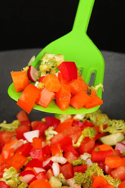 Vegetable ragout in wok, isolated on black — Stock Photo, Image