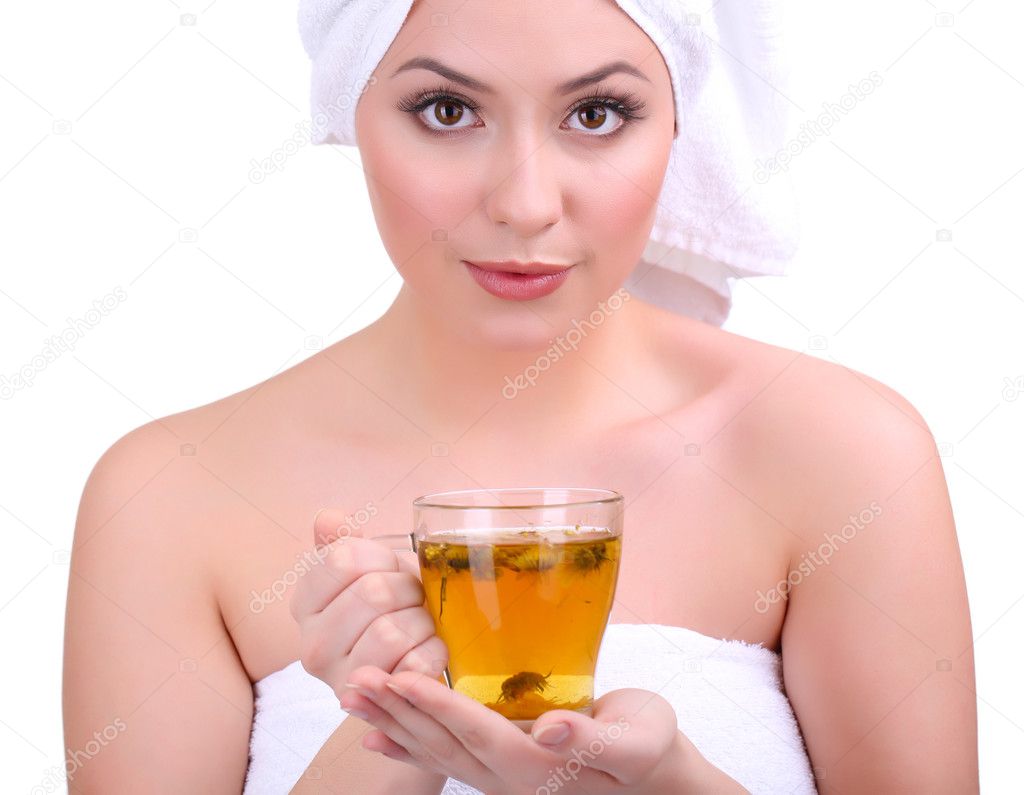Beautiful young woman with cup of herbal tea isolated on white
