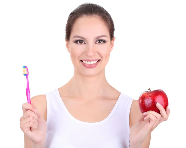 Mujer sonriente con manzana y cepillo de dientes aislados en blanco —  Fotos de Stock