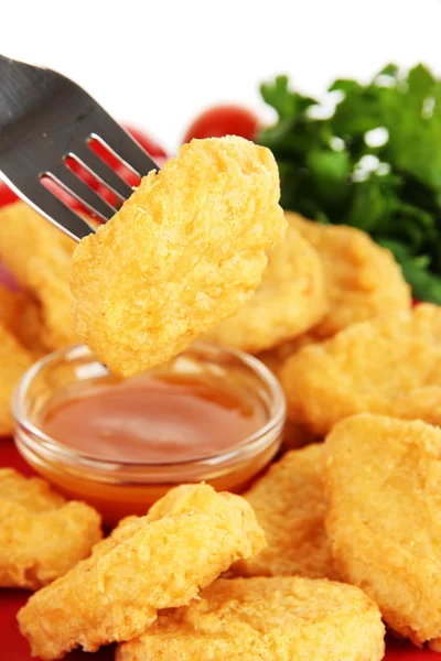 Fried chicken nuggets with vegetables and sauce isolated on white — Stock Photo, Image