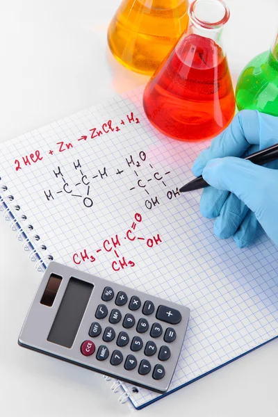 Hand scientist writing formulas isolated on white — Stock Photo, Image