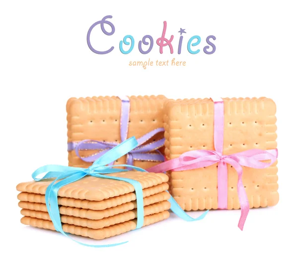 Sweet cookies tied with colorful ribbons isolated on white — Stock Photo, Image