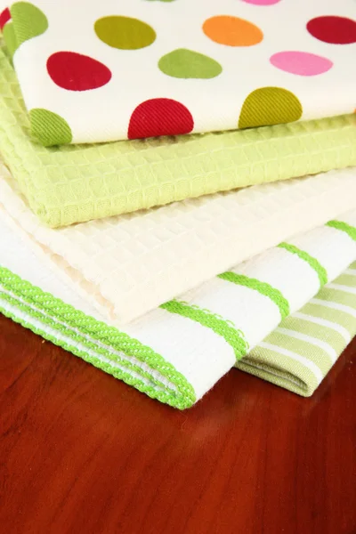 Kitchen towels on wooden background — Stock Photo, Image