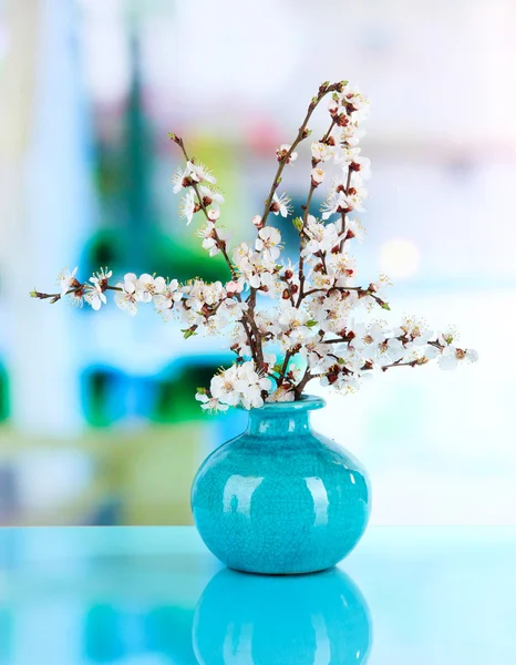 Beautiful blooming branches in vase on window background — Stock Photo, Image
