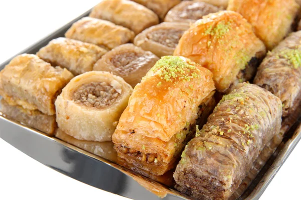 Sweet baklava on tray isolated on white — Stock Photo, Image
