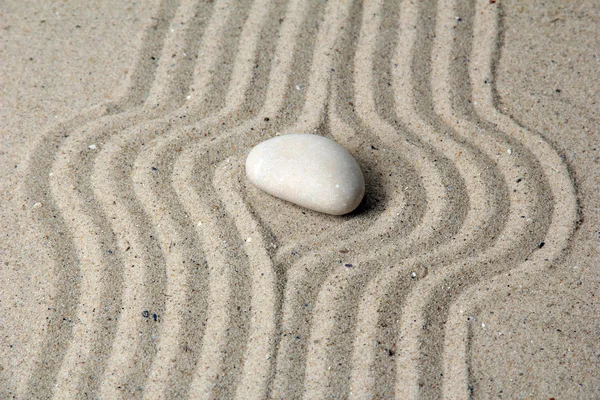 Zen garden with raked sand and round stone close up — Stock Photo, Image