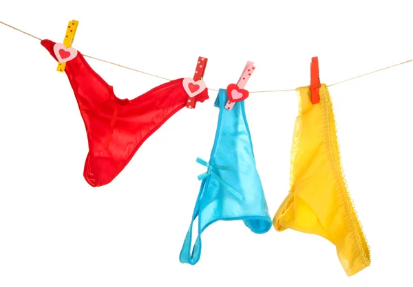 Women's panties hanging on rope isolated on white — Stock Photo, Image