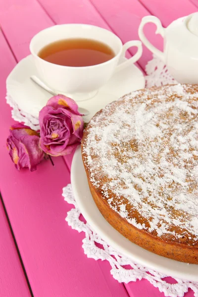 Delicious poppy seed cake with cup of tea on table close-up — Stock Photo, Image