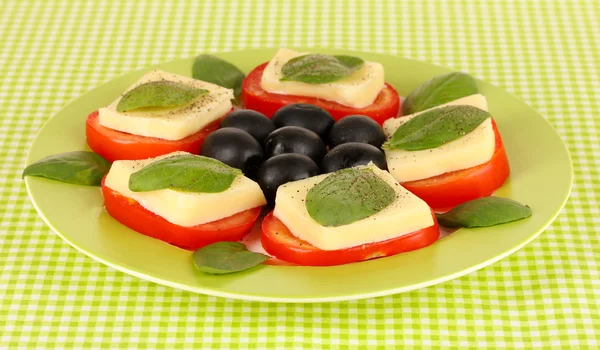 Cheese mozzarella with vegetables in plate on table — Stock Photo, Image