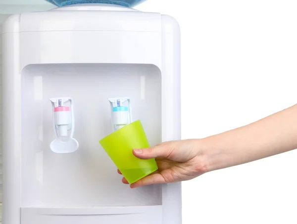 Woman filling cup at water cooler — Stock Photo, Image