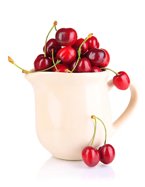 Ripe red cherry berries in pitcher isolated on white — Stock Photo, Image