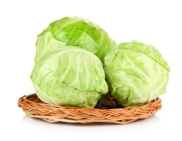 Green cabbage on wicker mat, isolated on white — Stock Photo, Image