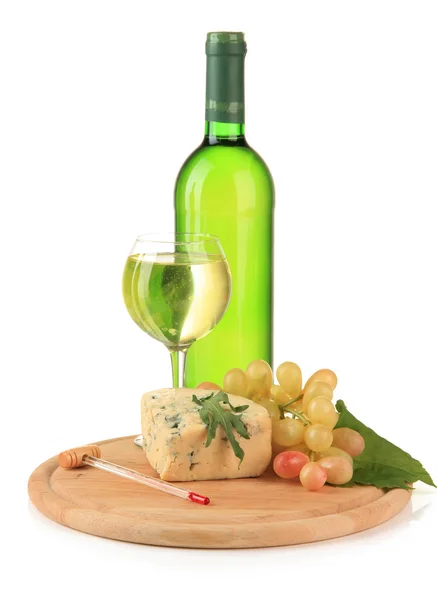 Wine, tasty blue cheese and grape on cutting board, isolated on white — Stock Photo, Image