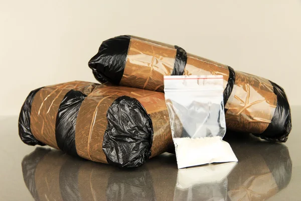 Packages of narcotics on gray background — Stock Photo, Image