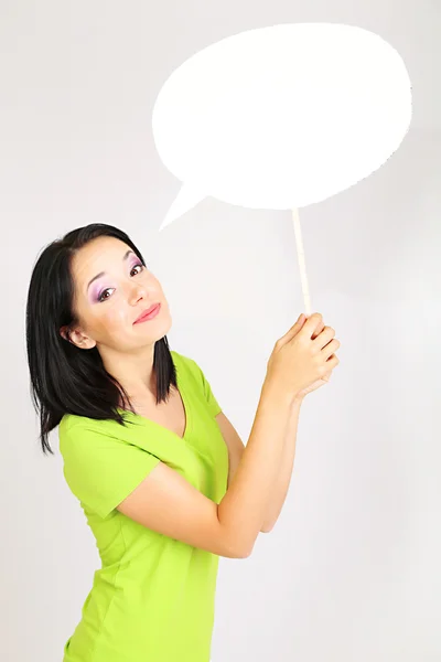 Thought girl in bubble next to it on grey background — Stock Photo, Image