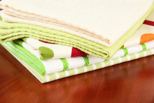 Kitchen towels on wooden background — Stock Photo, Image