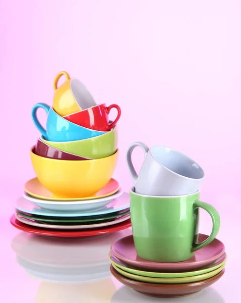 Mountain colorful dishes on pink background — Stock Photo, Image