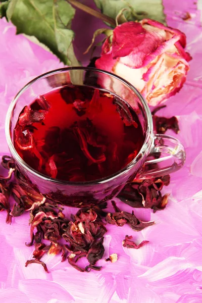 Herbal tea in glass cup, on color wooden background — Stock Photo, Image