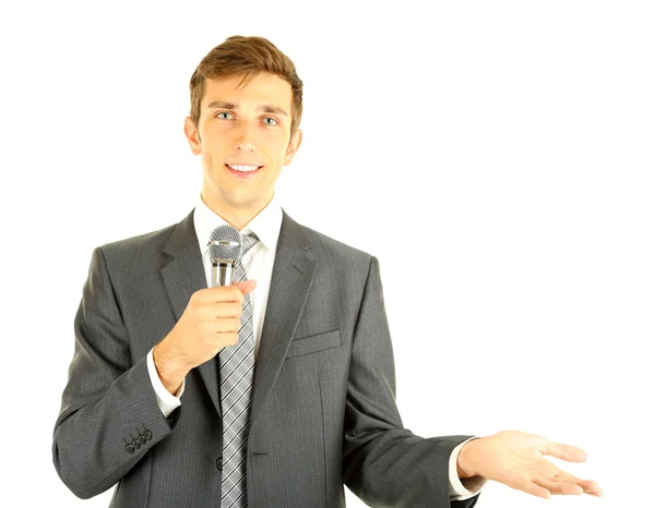 Young businessman talking with microphone, isolated on white — Stock Photo, Image