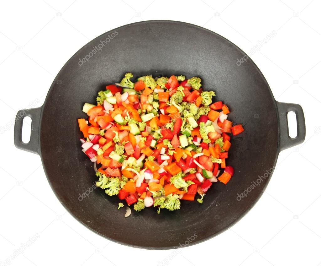 Vegetable ragout in wok, isolated on white