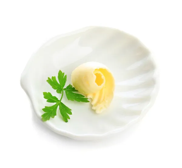 Máslo oblouček na desce, izolované na bílém — Stock fotografie