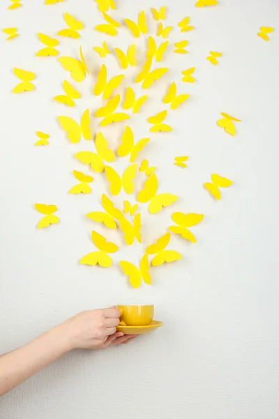 Paper yellow butterflies fly out of cup — Stock Photo, Image