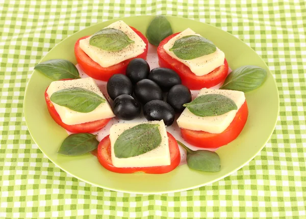 Cheese mozzarella with vegetables in plate on table — Stock Photo, Image