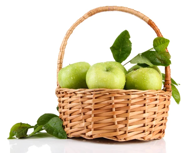 Juicy green apples with leaves in basket, isolated on white — Stock Photo, Image