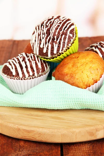 Sweet cupcakes on wooden table — Stock Photo, Image