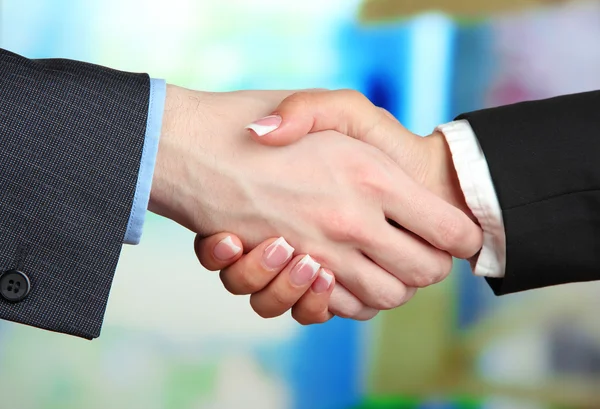 Business handshake on bright background — Stock Photo, Image