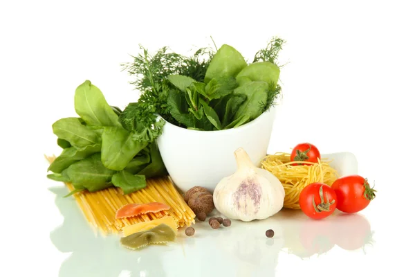 Composition of mortar, pasta and green herbals, isolated on white — Stock Photo, Image