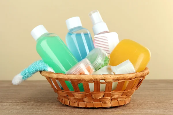 Hotel amenities kit on table on beige background — Stock Photo, Image