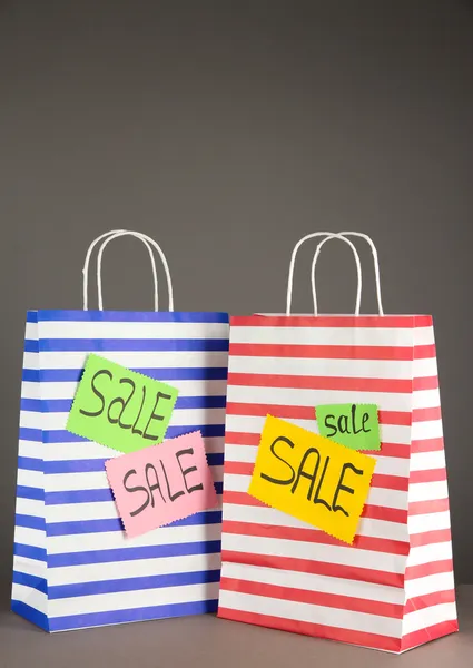 Striped bags on gray background — Stock Photo, Image