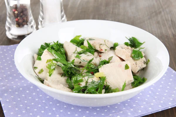 Boiled meat on plate on napkin close-up — Stock Photo, Image