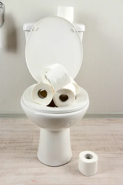 White toilet bowl with toilet paper in a bathroom — Stock Photo, Image