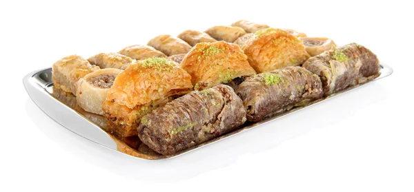 Sweet baklava on tray isolated on white — Stock Photo, Image