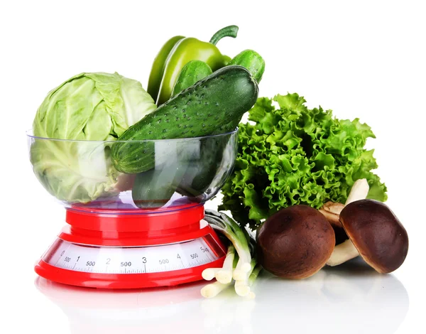 Fresh vegetables in scales isolated on white — Stock Photo, Image