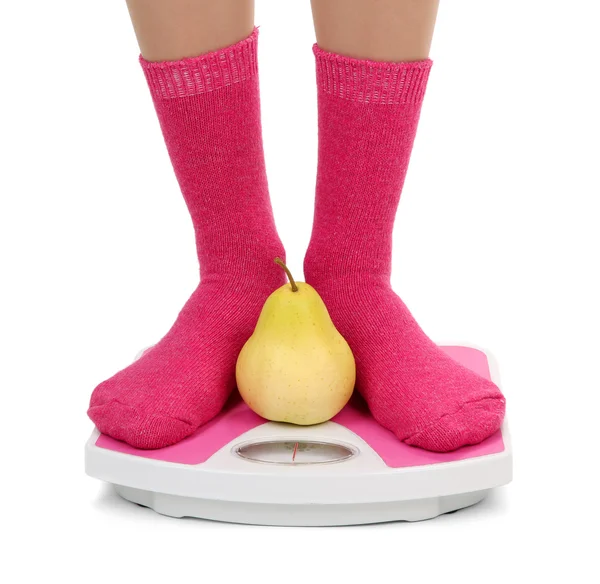 Female feet on scales, isolated on white — Stock Photo, Image