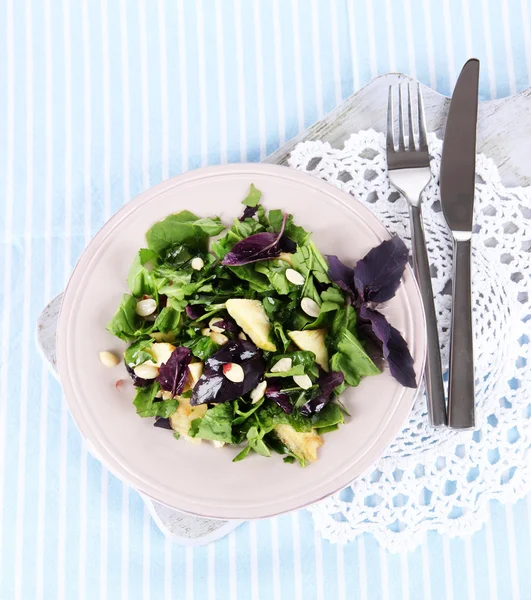 Light salad on plate on napkin — Stock Photo, Image