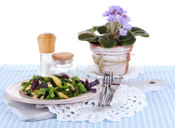 Light salad on plate on napkin on table — Stock Photo, Image