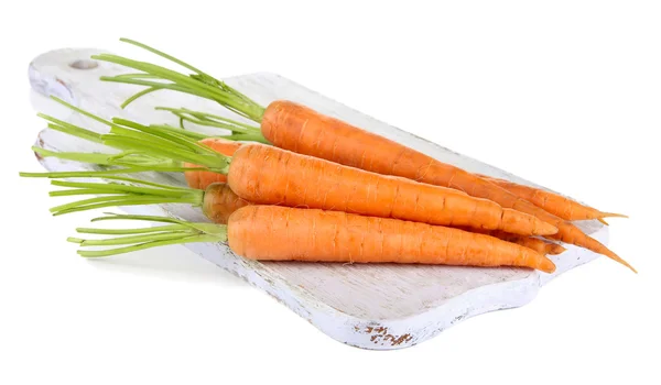 Zanahorias en la tabla de cortar, aisladas en blanco —  Fotos de Stock