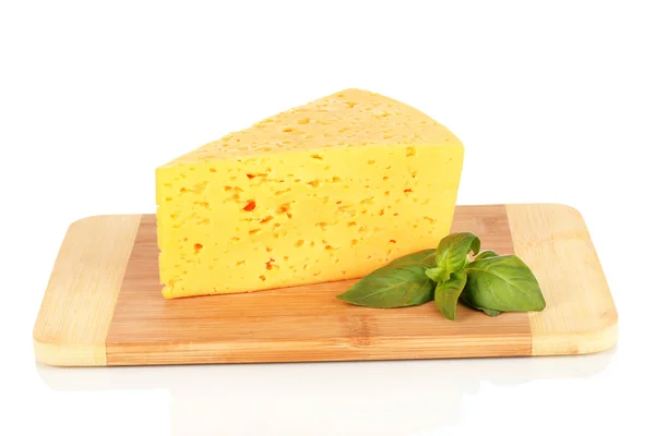 Cheese and basil on cutting board isolated on white — Stock Photo, Image